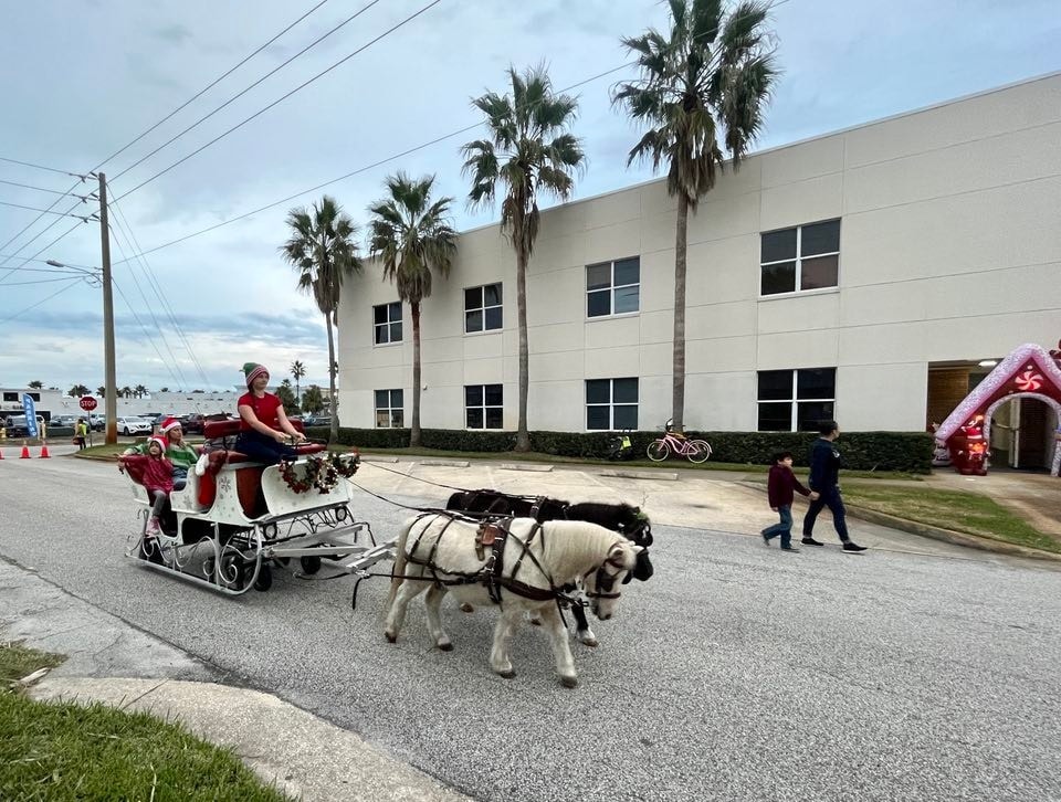 Our Sleigh giving sleigh rides at a Christmas party in Jacksonville Beach, FL.