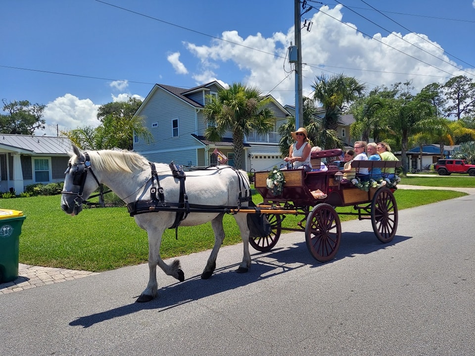 Here's our Big Red Wagon giving carriage rides at a Fall Festival in Jax Beach, FL.