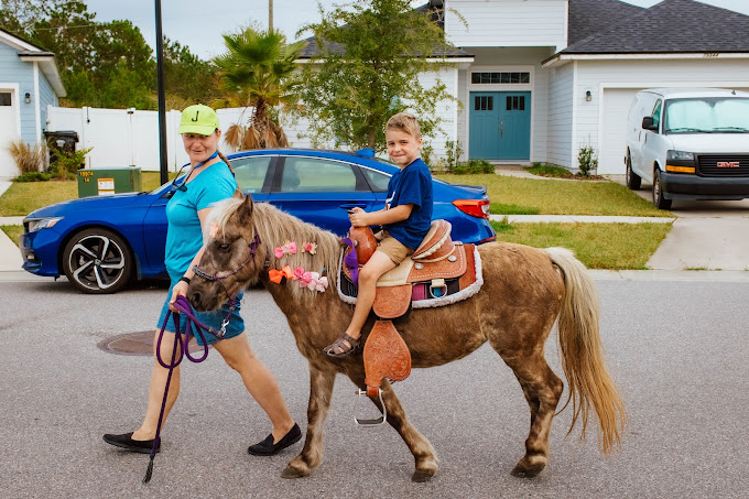 Here's our pony Mocha giving a pony ride at a birthday party in Gainesville, FL.