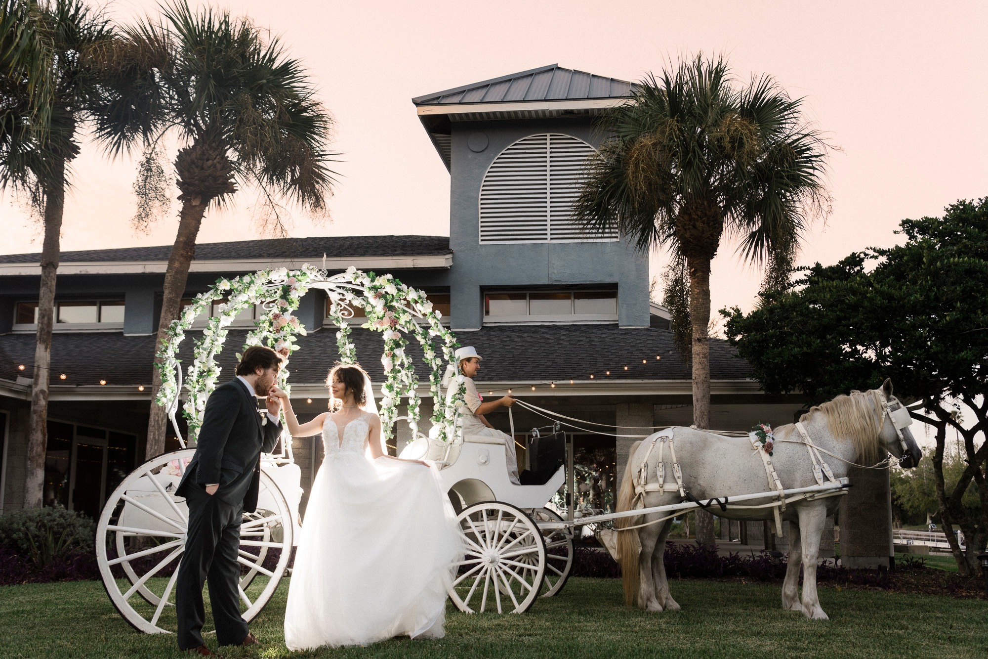 Our Big Cinderella Carriage with our horse Joy at a wedding ceremony in Palm Coast, FL at the lovely Channel Side wedding venue.