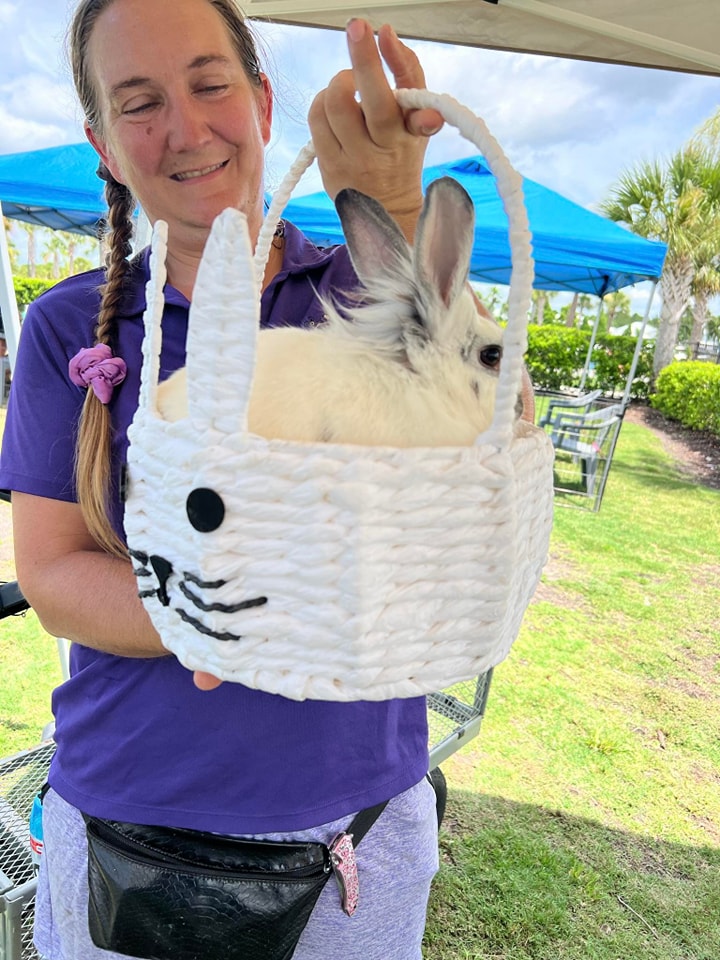 This is one of our bunnies named Roz enjoying a little ride in an Easter basket at this Spring and Easter celebration in Jacksonville, FL at a church.