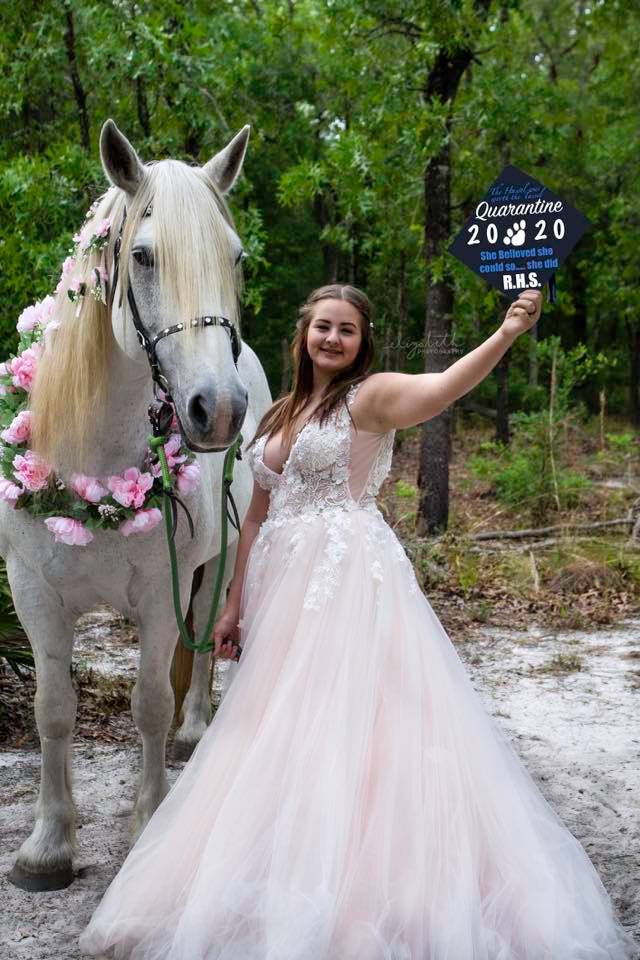 Here's our white horse Joy posing for a graduation photoshoot in Middleburg, FL.